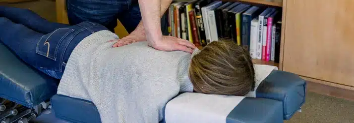 Chiropractor Watertown WI Joel Kirchberg Adjusting A Patient