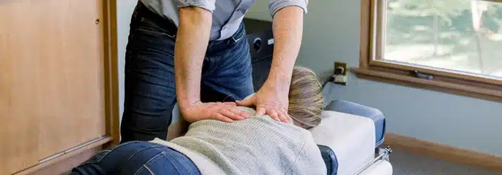 Chiropractor Watertown WI Joel Kirchberg Adjusting A Patient