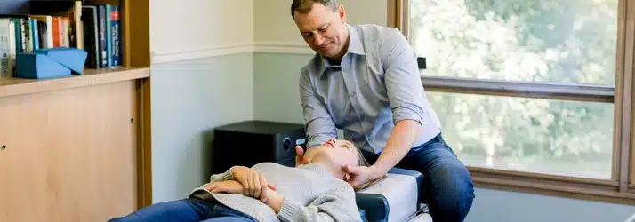 Chiropractor Watertown WI Joel Kirchberg Adjusting A Patient